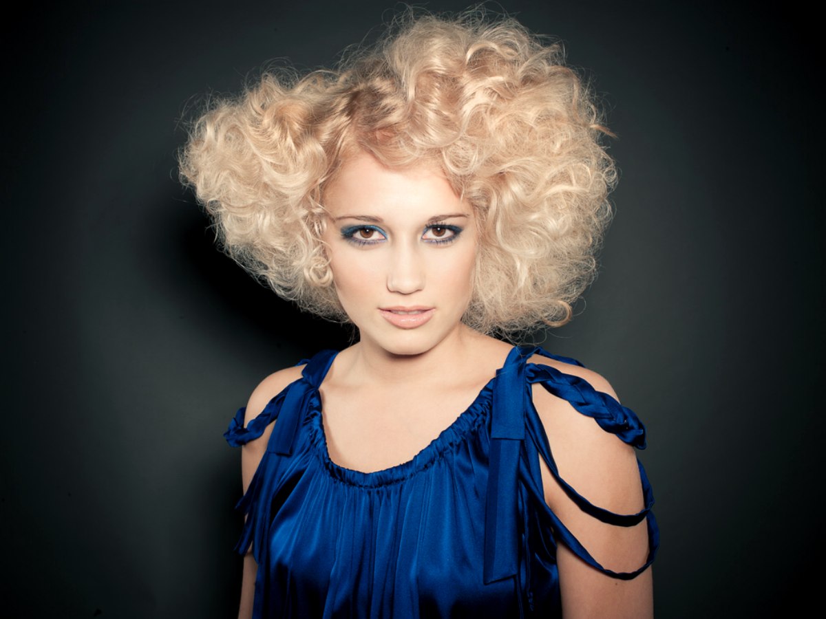 Honey Blonde Retro Hair With Curls That Frame The Face
