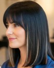 Straight dark brown shoulder-length hair with caramel highlights