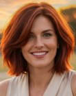Red-toned above the shoulders bob