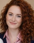 Long red hair with spiral curls