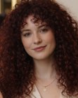Long dark red hair with curls