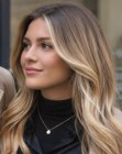Long honey-blonde hair with waves