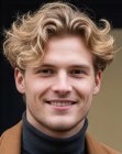 Man with short blonde wavy hair