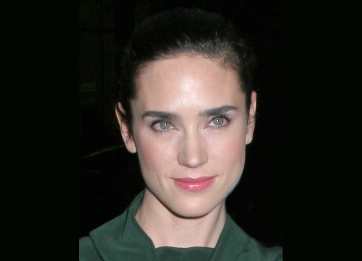 Jennifer Connelly with her hair pulled back into a ponytail and