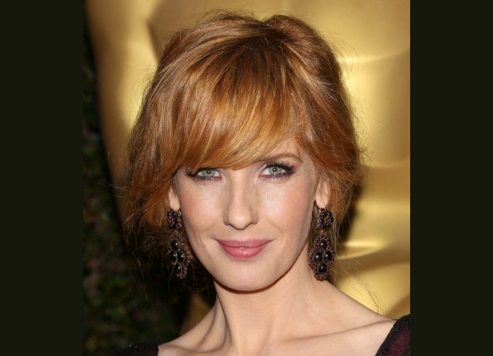 Kelly Reilly  Loose up-style that gives the effect of a short haircut