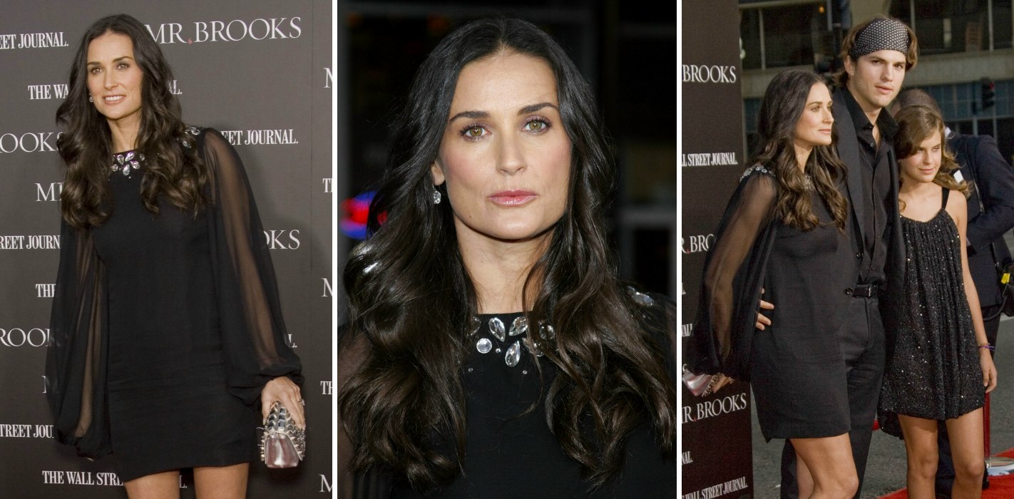 Demi Moore with long brunette hair and curls