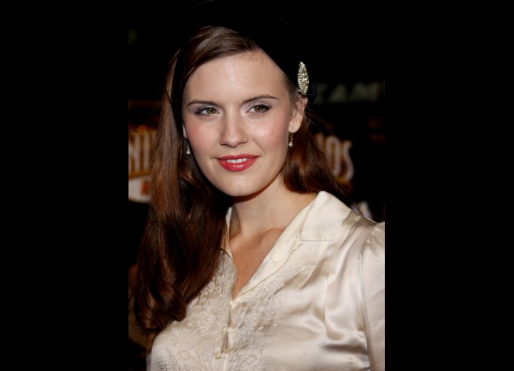Maggie Grace's 1950s hairstyle with spiral curls and a beret