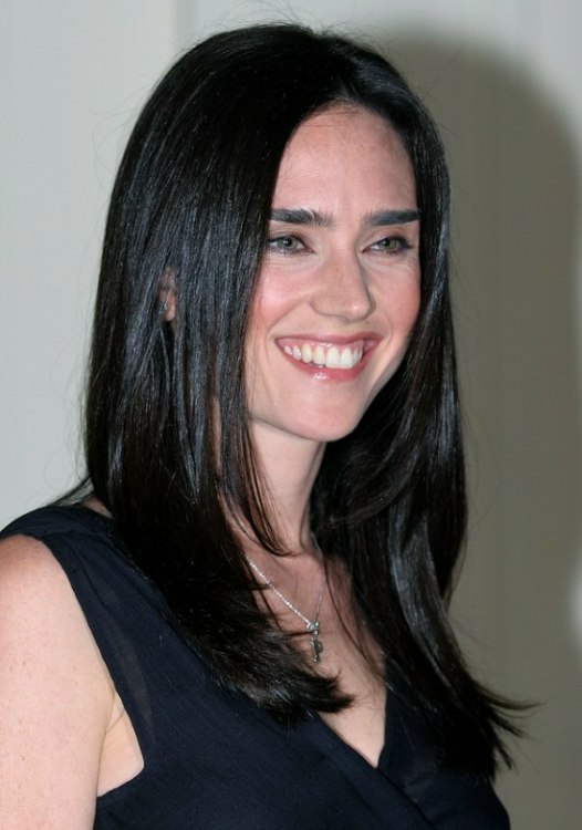 Jennifer Connelly with her long raven black hair styled to 