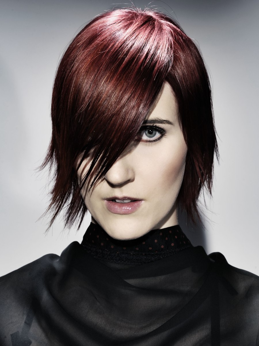 Goth inspired short hairstyle with a slender shape and purple hair color