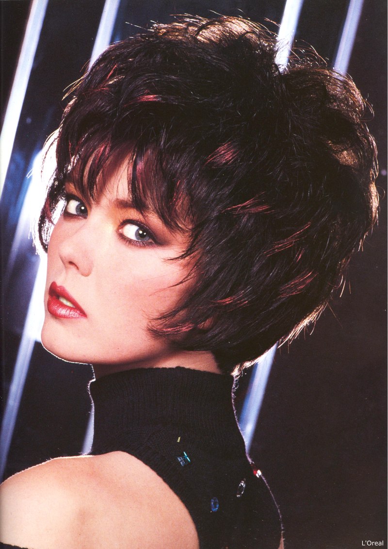 Short 1980s haircut with spiky sections around the face