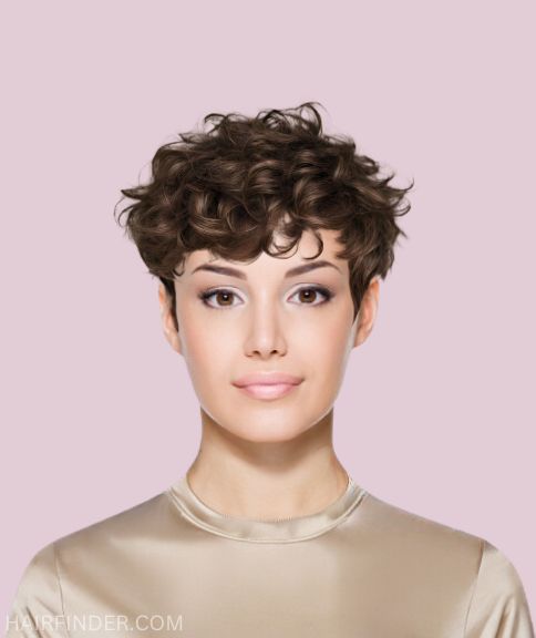 Curly pixie cut with a soft feminine fringe