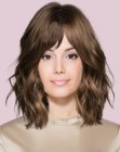 Shoulder-length hair with curtain bangs