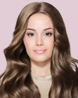 Hair with soft waves and a center part